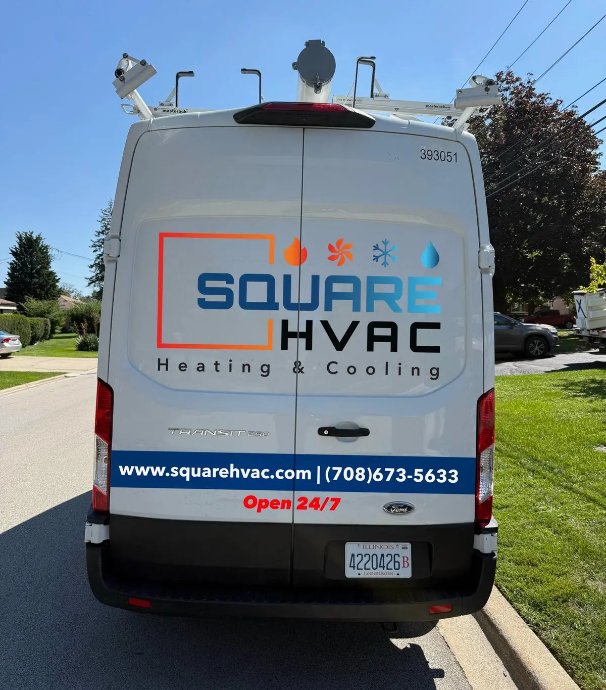Rear of a SquareHVAC service van with the logo, the website and the phone number